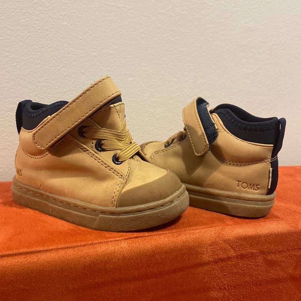 Tom’s size four boots